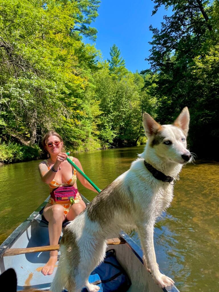 Woman and dog in the boat